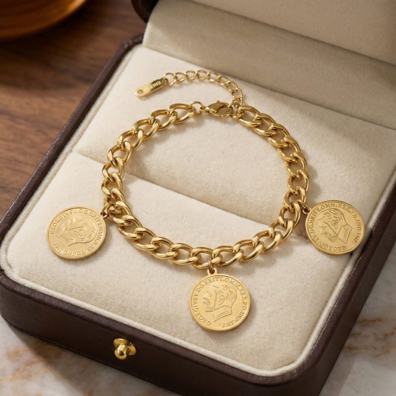 An elegant gold bracelet made of rust-resistant stainless steel, decorated with three classic coins, for a sophisticated and modern look, with an adjustable clasp to suit you. - Image 4